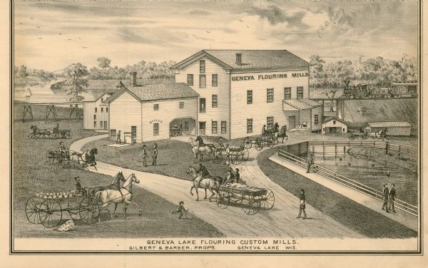 A print depicts activity around the three-story, wood frame Geneva Flouring Mills. Horse-drawn wagons, pedestrians, and a boy rolling a hoop create a busy scene. Two well-dressed gentlemen converse on the lawn and a man fishes in the mill race. In the background is a Chicago and North Western train.