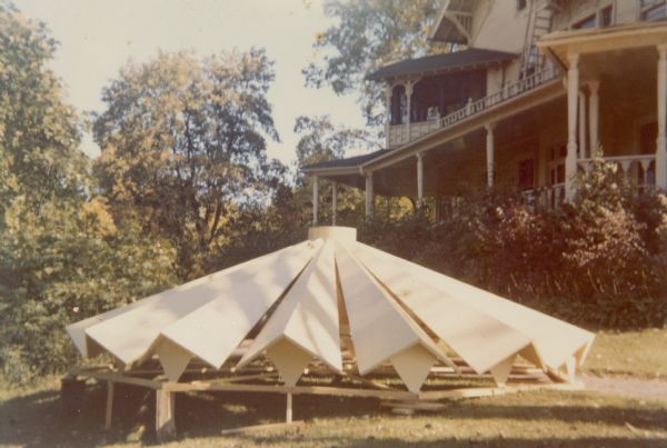A new roof for the tower of the main house at Black Point stands on the lawn in front of the house. The roof, of an ultra-modern design, rests on a short scaffold.