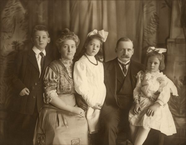 Clara Seipp Bartholomay (1871-1956) and her husband, Henry Bartholomay, Jr. pose with their children, from left, Henry Conrad, Catherine, and Elsa Marie for a formal family portrait. Clara was a daughter of Chicago brewer Conrad Seipp. She and her family owned the large 1905 cottage at Black Point Estate.