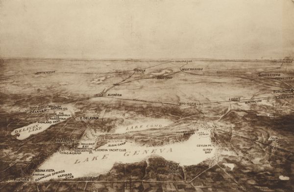 Bird's-eye view of Lake Geneva from the south extending to Waukesha and Milwaukee in the north. Delavan Lake and Lake Como are identified. Several electric and standard rail lines are depicted, as well as major roads. Points of interest include Yerkes Observatory, the YMCA camp, and several clubs on Lake Geneva.