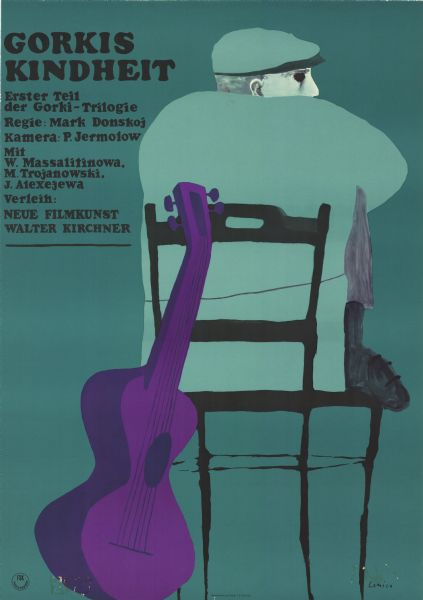 German film poster for the Russian film, "Detstvo Gorkogo." Illustrated image from the back of a man wearing a hat and coat. He is sitting with his feet up in a chair and looking to his right. A guitar rests against the back of the chair.