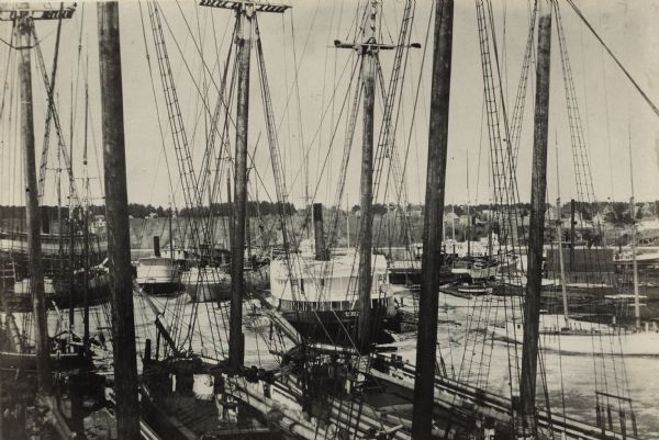 Caption reads: "Some of the Old-Timers on the Photo. Steamers: Petosky (on stocks), Muskegon, Corona, A.D. Hayward, City of St. Joe, Lotus, J.F. Dayan, Grace Williams and Tug George Pankratz Schooners: Henry C. Richards, Industry, C.H. Hackley, Bells Brown, Cuyhoga, G.D. Dousman, W.C. Kimball, and Scows, City of Manitowoc and Success."