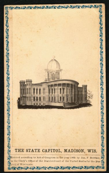 Image of the Wisconsin State Capitol mounted on a decorative card by the photographer J.F. Bodtker. The text on the back of the card reads:  From J.F. Bodtker's Photography Gall'y, Over the Post Office, Madison, Wis.