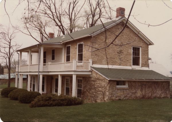 This is number two in Stanley Hanks' collection of four prints of the Keystone House in Shorewood. This historic stone farmhouse, at 901 University Bay Drive, was renovated by Freda Keys Winterble. The house was named "Keystone" after her family. The farmhouse was built by William J. Petherick in 1853. The Wisconsin Alumni Research Foundation bought it in 1967 and donated it to the University of Wisconsin-Madison. It is the home of the Max Kade Institute for German American Affairs.