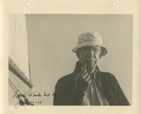 Lucien "Louie" Hanks, brother of Stanley Hanks (born June 27, 1868), smoking a pipe while on a sailboat. He graduated from the University of Wisconsin in 1889.