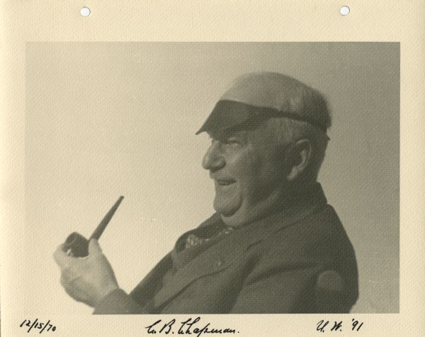 Portrait of C.B. Chapman smiling while holding a pipe. He is wearing a suit, an ascot tie, and a sun visor. Chapman graduated from the University of Wisconsin in 1891. He was born December 15, 1870.

Chandler Burnell Chapman was a Madison realtor and life long friend of Stanley Hanks. He was a veteran of the Spanish-American War. He was president-treasurer of the Lake Forest Land Co and was treasurer of the Wisconsin Life Insurance Co.