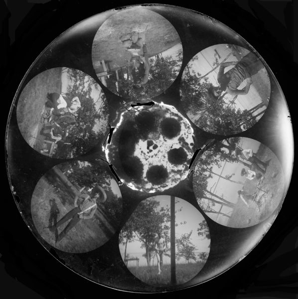 Six circular images on a glass plate negative from the Stirn Concealed Vest camera owned by Stanley Hanks. These six images are of young men engaged in outdoor activities.