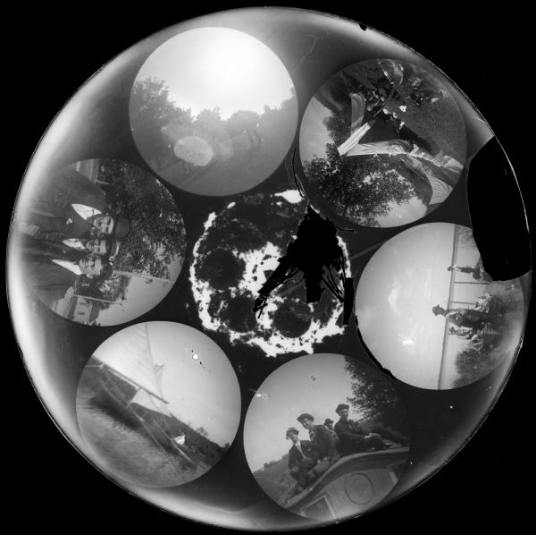 Six circular images on a glass plate negative from the Stirn Concealed Vest Camera. Most of the images are primarily of young men posing near or in boats, one is of a man near tents, and one is of a group of men posing on a lawn.