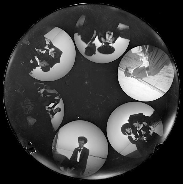 Six circular images on a glass plate negative from the Stirn Concealed Vest Camera. The images are of young men and women posing near a shoreline or on boats.