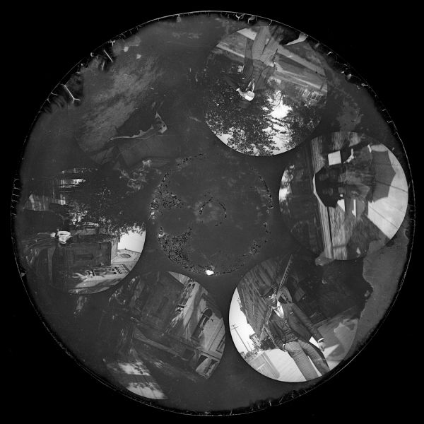 Six circular images on a glass plate negative from the Stirn Concealed Vest Camera. The same young man wearing a suit is in two images; three images are of young women walking down a sidewalk; and another is of a light-colored dog nursing a pile of dark-colored puppies.