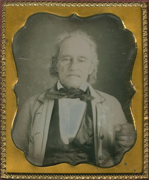 Sixth plate daguerreotype. Quarter-length portrait of Isaiah Boone. Mr. Boone is holding a cane in his hand. Boone was from Indiana.