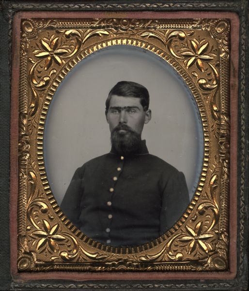 Sixth plate ferrotype/tintype of an unidentified soldier from the 13th Wisconsin Infantry. Hand-coloring on cheeks and gold details on buttons of military uniform.