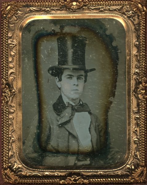 Ninth plate daguerreotype of William B. Noyes at the age of 16. Noyes is wearing a suit and top hat. Noyes was born in New York City on January 11, 1836. He emigrated to Janesville where he married Julia Ann Dana Page on October 10, 1858. Their son William Cowper Noyes was born in Janesville on February 16, 1862, and died at the age of three from dysentery.