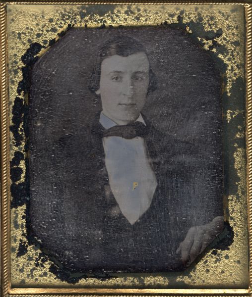 Sixth plate daguerreotype of George Krips of Philadelphia, Pennsylvania. George is the uncle of the donor of the portrait, Mrs. Julia Hicks. The portrait is a bust figure with the subject facing front and his head turned slightly to the right. Hand-coloring on cheeks, and gold details on center button.