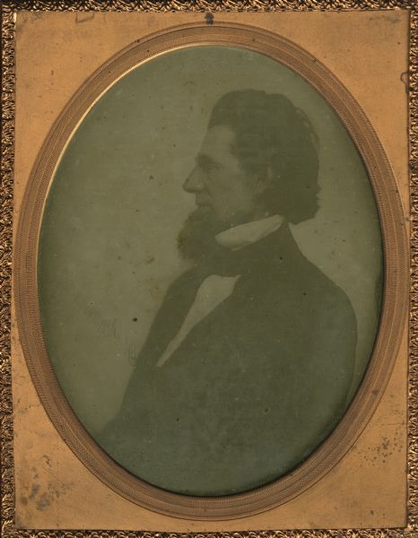Quarter plate ambrotype of Daniel Wells Jr. The portrait is from waist-up of left profile, with some scratching and damage to the plate. Daniel Wells Jr. emigrated to Wisconsin from Maine prior to 1848. He was a grain and lumber merchant in Milwaukee. Wells Avenue and the Wells block in Milwaukee are named for him.