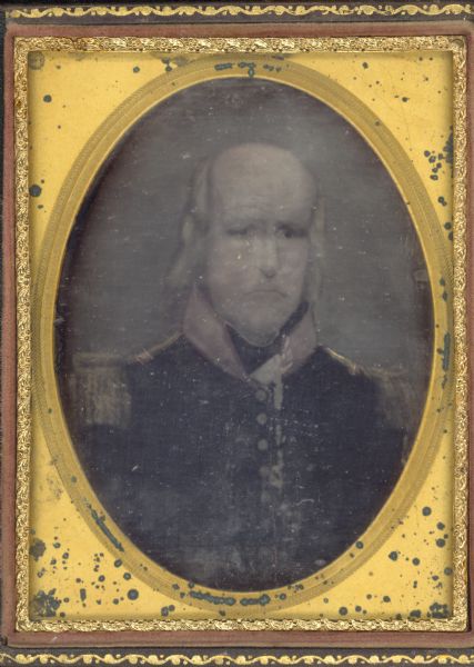 Quarter plate daguerreotype of a painting of General George Rogers Clark, as an older man. Clark is most well known for his role in the defense of the Northwest territory during the American Revolution. The portrait is a front facing, bust figure. The portrait has considerable fading, and at one time there may have been gold applied to the lapels and shoulders of the portrait, but this can only be faintly seen now.