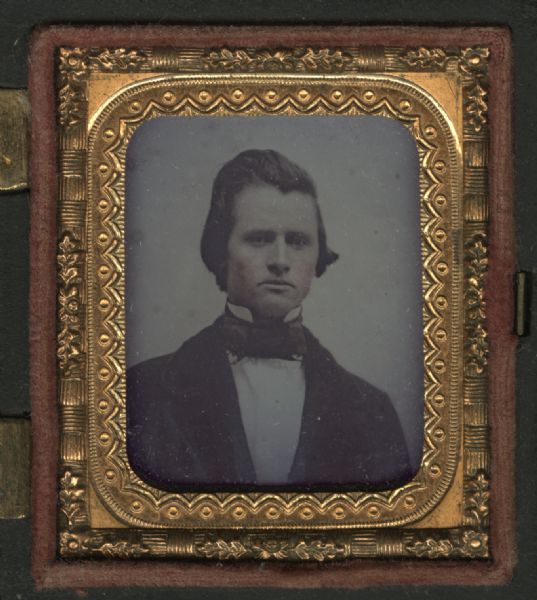 Sixteenth plate ambrotype of George Ransom Gardner. Half figure facing front and slightly right, wearing coat, tie, and stand collar. Hand-coloring on cheeks. Gardner served in the 48th regiment NY State Volunteers during the Civil War, where he lost his right arm. He taught school in Missouri. He studied law and was licensed to practice in New York, and became a prominent Wisconsin Rapids attorney. He died during the progress of a famous murder trial while assistant to the DA.