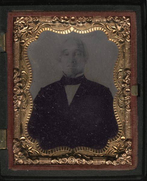 Ninth plate ferrotype/tintype of John Z. Saxton. Half figure facing front, with goatee, wearing coat, tie, and stand collar. Saxton was the stepfather of Josephine and Bob La Follette. 