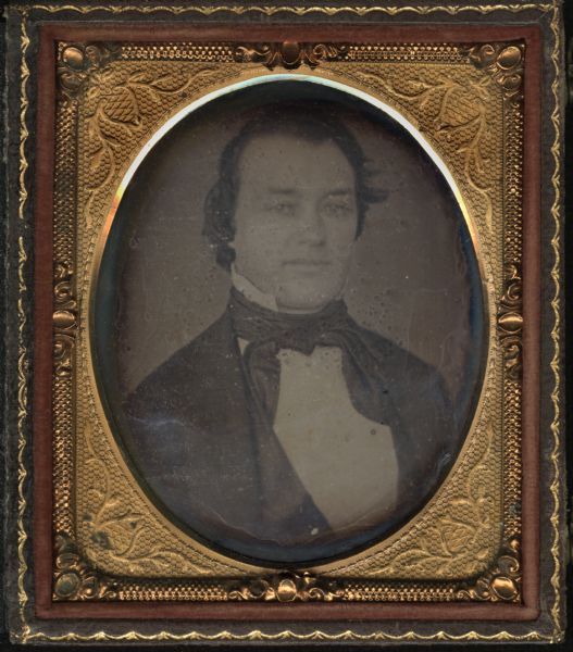 Sixth plate daguerreotype of Timothy Burns. Quarter figure facing front and slightly right, wearing coat, vest, stand collar, and tie with long tails. Burns was Lieutenant Governor of Wisconsin c. 1852-1854.