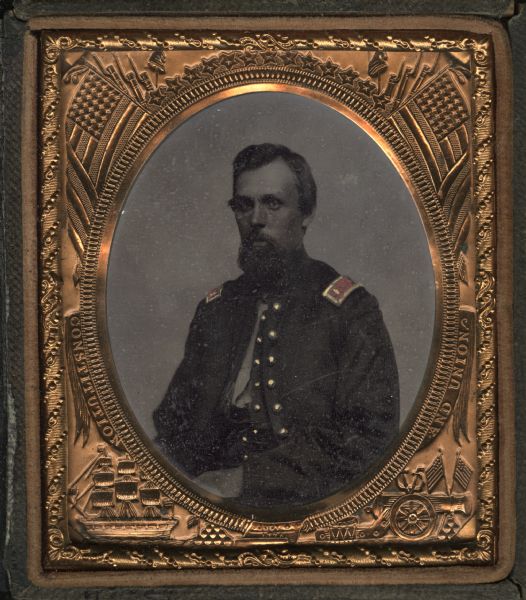 Sixth plate ferrotype/tintype. Waist-up portrait of Lieutenant Daniel Webster, 1st Wisconsin Battery, Light Artillery. Hand-coloring on cheeks and epaulettes, gold details on epaulettes and buttons.