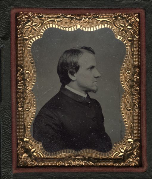 Ninth plate ferrotype/tintype quarter-length profile portrait of Reverend C.J. Hendley. Episcopal clergyman. Married to Jane Olive Kimball, July 20, 1865 in Waukesha, Wisconsin. Hand-coloring on cheeks.