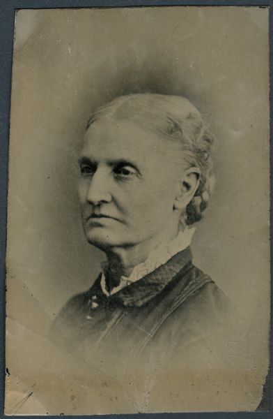 Sixth plate ferrotype/tintype. Head and shoulders portrait of Mrs. Augustus A. Bird. A pioneer woman who came from New York to Milwaukee by a team of horses in 1836, and from Milwaukee to Madison in 1837. She was the second white woman in Madison, and the wife of the architect and builder of the first capitol building in Madison.