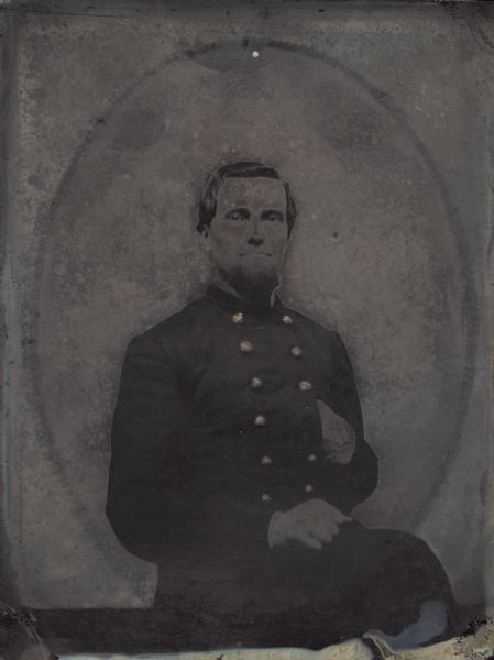 Half plate ferrotype/tintype. Waist-up portrait of Colonel Peter Ege. Hand-coloring gold detail on buttons.