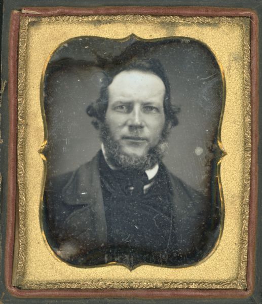 Sixth plate daguerreotype of Thomas Beers, grandfather of Zona Gale Breese. Quarter-length portrait facing forward. He is wearing a wide collared suit coat and tie, and somewhat graying chin whiskers. 
