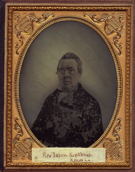 Half plate ambrotype of Reverend Jason Lothrop of Kenosha, Wisconsin. Waist-up portrait facing front, torso slightly to left. He is wearing a suit and stand collar. 