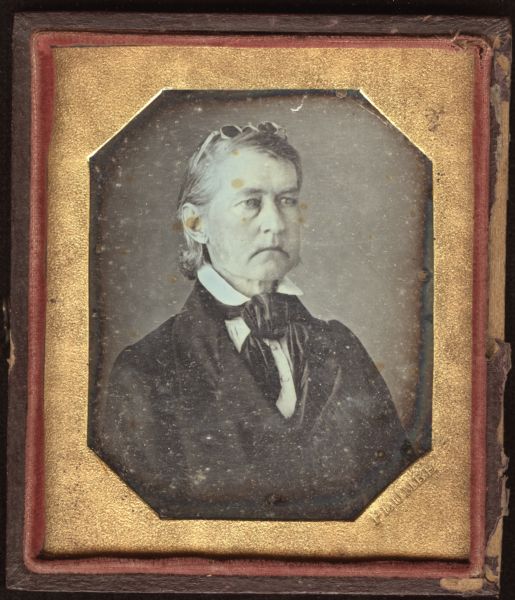 Sixth plate daguerreotype of Jacob Porter Norton (1793-1846). Quarter-length portrait, facing slightly right. Norton is wearing a suit, bow tie, and stand collar. His hair is chin length, and has spectacles resting on top of his head. Porter was a Mount Zion, Georgia resident, veteran of the War of 1812, and father of Madison, Wisconsin resident Richard Greenleaf Norton. 