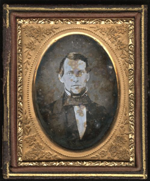 Ninth plate daguerreotype of Richard Greenleaf Norton (1829-?).  Quarter-length portrait facing front. He is wearing a suit, stand collar and cravat. Norton was a Madison, Wisconsin optical instrument maker. 