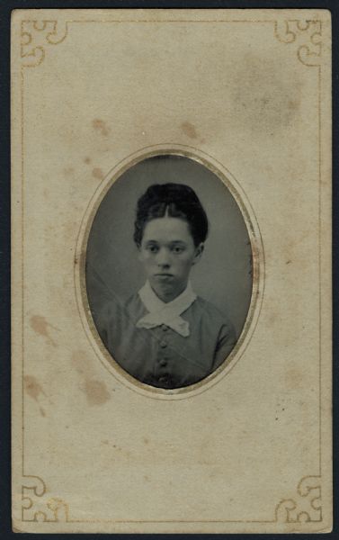 Ferrotype/tintype of a quarter-length portrait of Susannah Arnold-Frazee. She is wearing a button-front dress with a white collar.