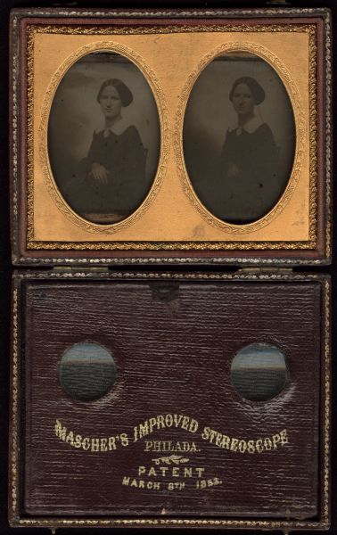 Two identical ninth plate ambrotypes of an unidentified woman, set into a Mascher's Improved Stereoscope viewing case, patented March 8th, 1852. She wears a dark dress with large lace collar and brooch at the neckline, and has a ring on her right hand. 