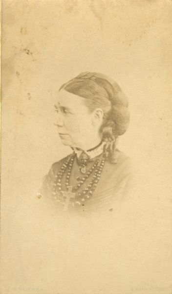 Vignetted quarter-length portrait of Elizabeth Hayman Layton. She was the sister of Joel Hayman, and the wife of Frederick Layton, who she married in 1851.