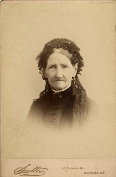 Vignetted quarter-length portrait of Orpah Dawson in a headdress and high-collared dress. Orpah Layton Dawson was Frederick Layton's aunt and Grace Hayman Fowle's great grandmother.