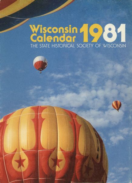 Outside front cover of the 1981 State Historical Society calendar. View of hot air balloons ascending near Wisconsin Dells.