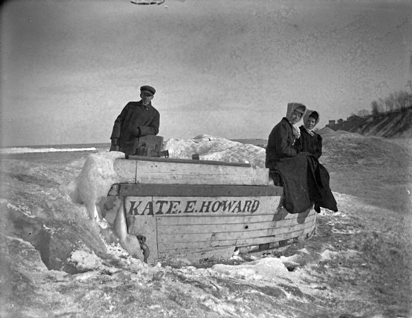 Hattie Taylor and her neighbors on the icy shoreline of Lake Michigan near the row boat "Kate E. Howard."