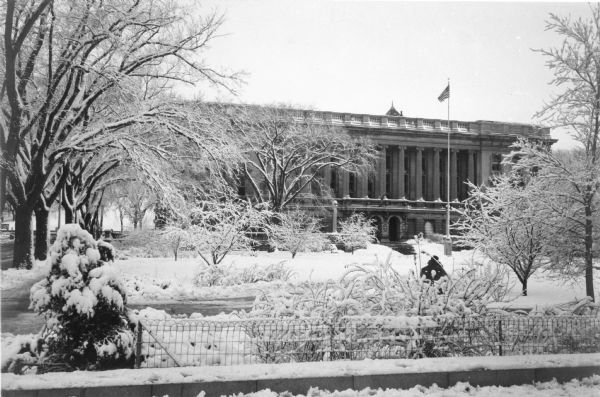The State Historical Society of Wisconsin building and grounds after a snowstorm. State Street is on the far left, with Bascom Hill in the background.