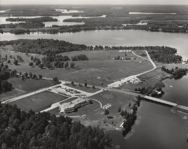Aerial view of Northernaire Resort, on Deer Lake. The resort is in the foreground. Many lakes, surrounded by trees, are in the background, including Big Stone Lake, Laurel Lake, and Medicine Lake. The Highway 32 bridge crosses between Deer Lake and Big Stone lake.