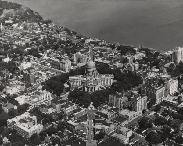 Aerial view of the Wisconsin State Capitol building and surrounding Madison area. Lake Monona is in the background.