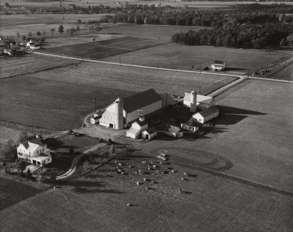Aerial photograph of the Baumgartner Dairy Farm, one half mile east of Three Lakes, WI.