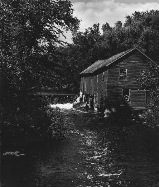 Cushman Mill, a sawmill on the shore of the Bark River.