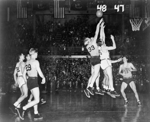 Badger basketball game against Illinois in the University of Wisconsin-Madison Field House. (Up to 1947) Wisconsin has won or tied for more Western Conference championships in this sport than any other school.