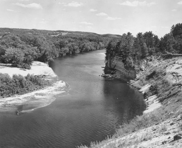 Elevated view of the Black River, with rock outcroppings, sand bars and trees. It is approximately 190 miles long and is a tributary of the Mississippi River.