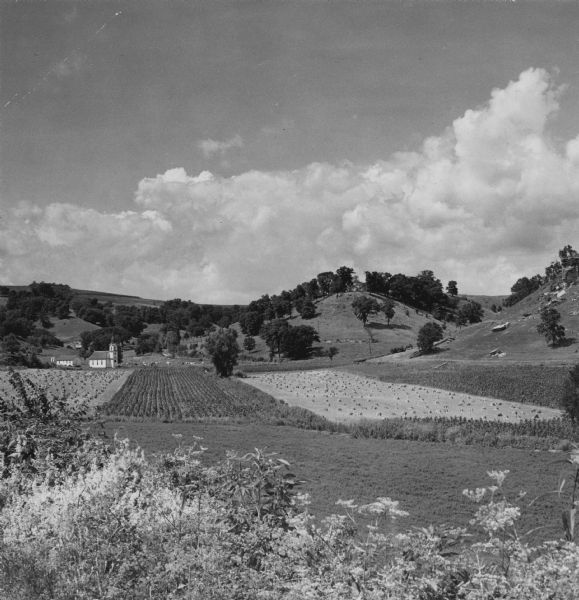 Wisconsin farm scene, south of Lone Rock, but in Iowa County. A church can be seen on the left. The hills are the south bluffs of the Wisconsin River.