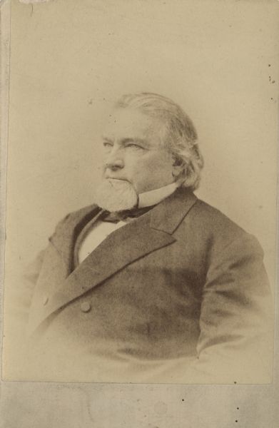 Waist-up portrait of Governor Cadwallader Colden Washburn, Wisconsin's 11th governor. He is facing slightly towards the left and is wearing a suit, necktie and an upright collar.