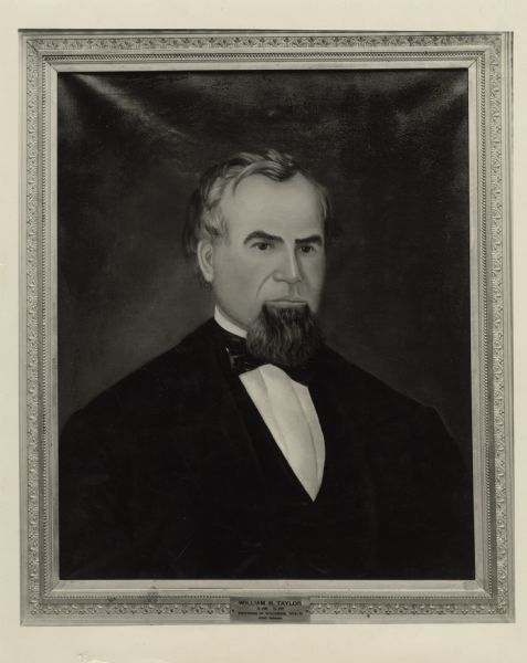 Quarter-length portrait of Governor William R. Taylor. He is wearing a suit and necktie, and is facing slightly towards the right.