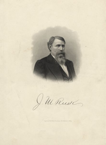 Quarter-length engraved vignette portrait of Wisconsin's 15th governor Jeremiah Rusk. He is wearing a suit, and has a beard and moustache. Rusk's signature is reproduced below the portrait.