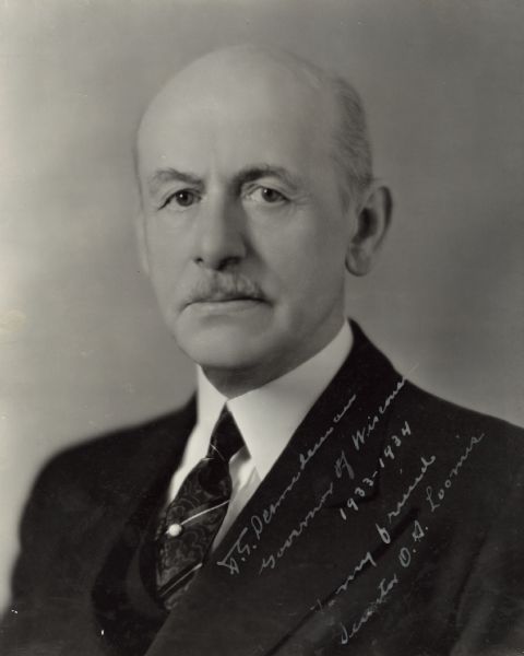 Quarter-length portrait of Albert Schmedeman, Wisconsin's 28th Governor. Written on the image along Schmedeman's lapel is "A.G. Schmedeman, Governor of Wisconsin 1933-1934. To my friend Senator O.S. Loomis."