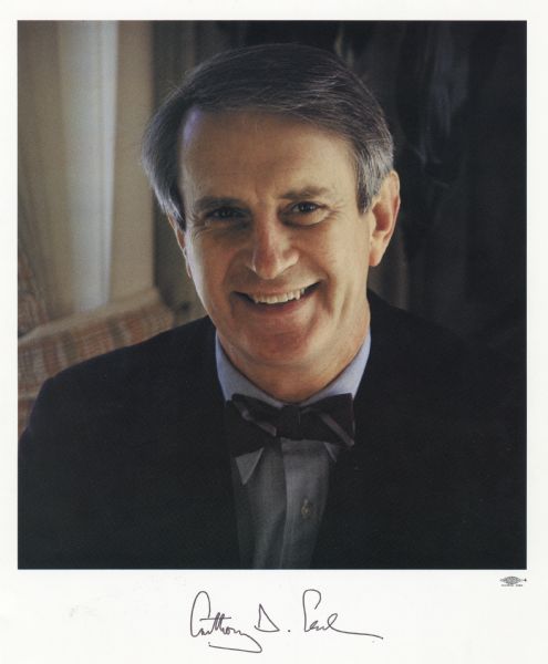 Quarter-length portrait of Anthony Earl, Wisconsin's 41st governor. He is wearing a bow tie and blue suit. The photograph is autographed by the governor.